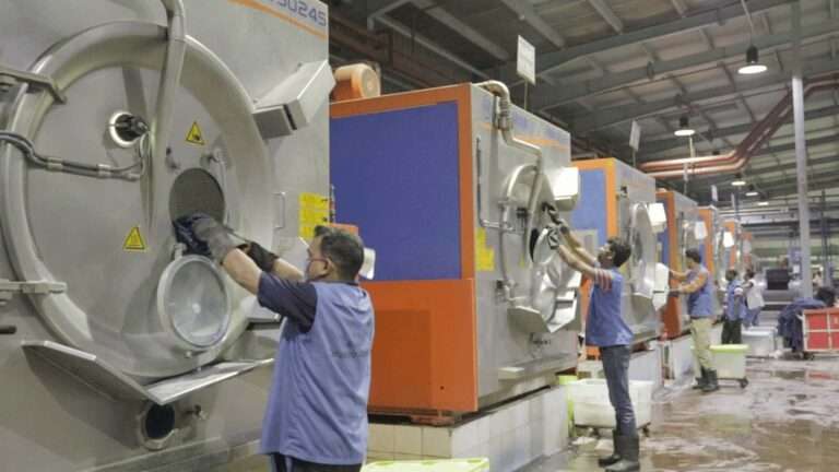 RMG is the leading revenue source for Bangladesh. Tarasima group worker working in washing unit.